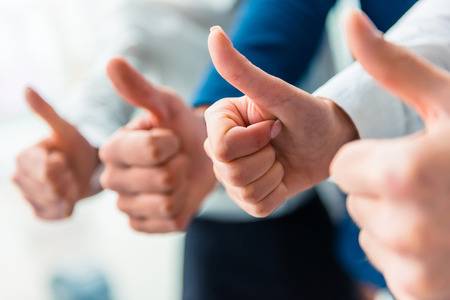 47971379--hands-close-up-group-young-business-people-talking-at-office-.jpg