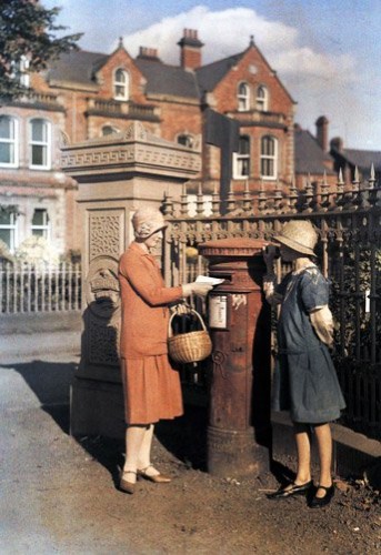 wo-girls-send-a-letter-at-the-red-pillar-box-of-the-Royal-Mail.-Belfast-Ireland.jpg