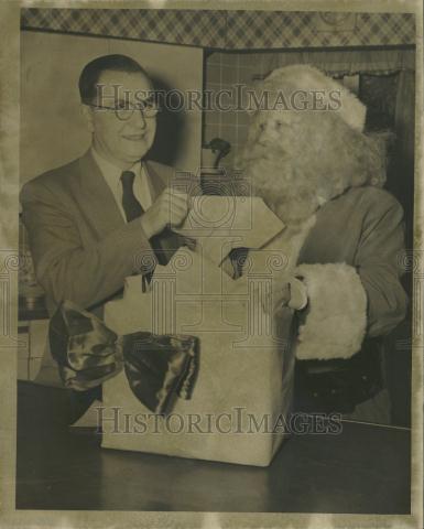 1955 Press Photo Francois Pope, and Santa Claus pull the winning letter from box.jpg